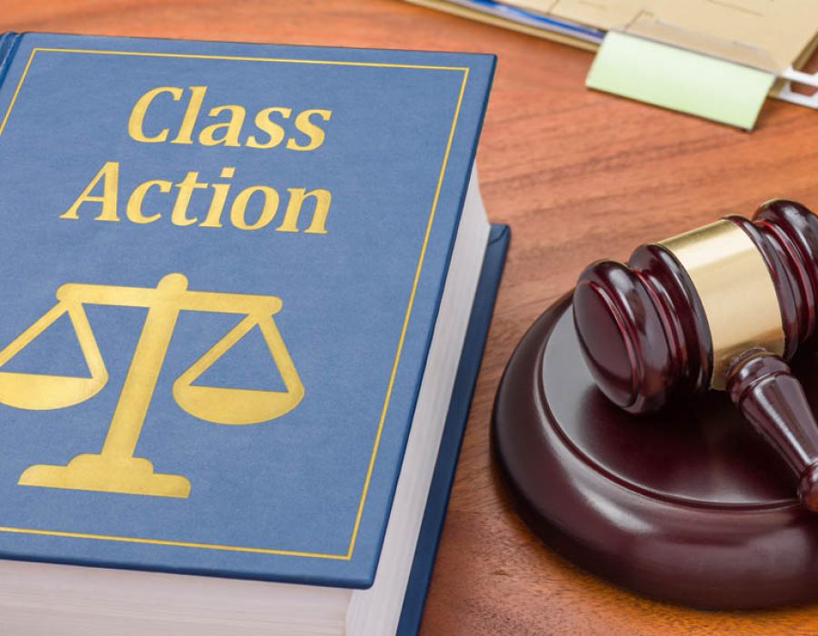 A law book with a gavel - Class action